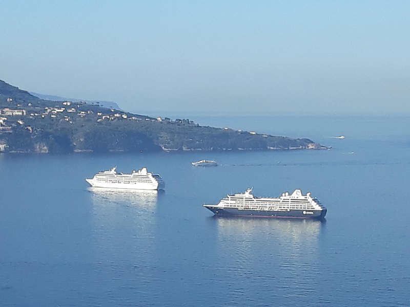 Two cruise ships lying at anchor off the Capri coast