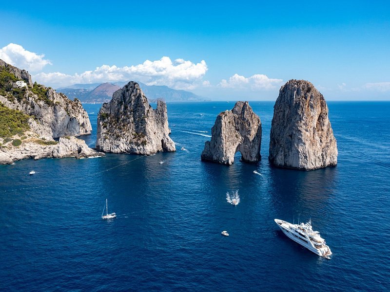 The three Faraglioni stacks standing off the south-east coast of Capri