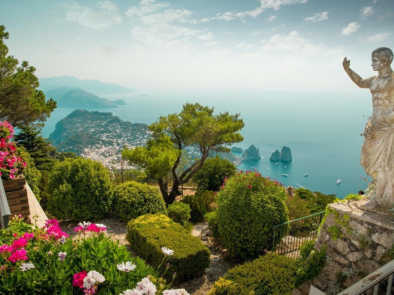 The planted terraces of the Gardens of Augustus, with a statue looking out to sea
