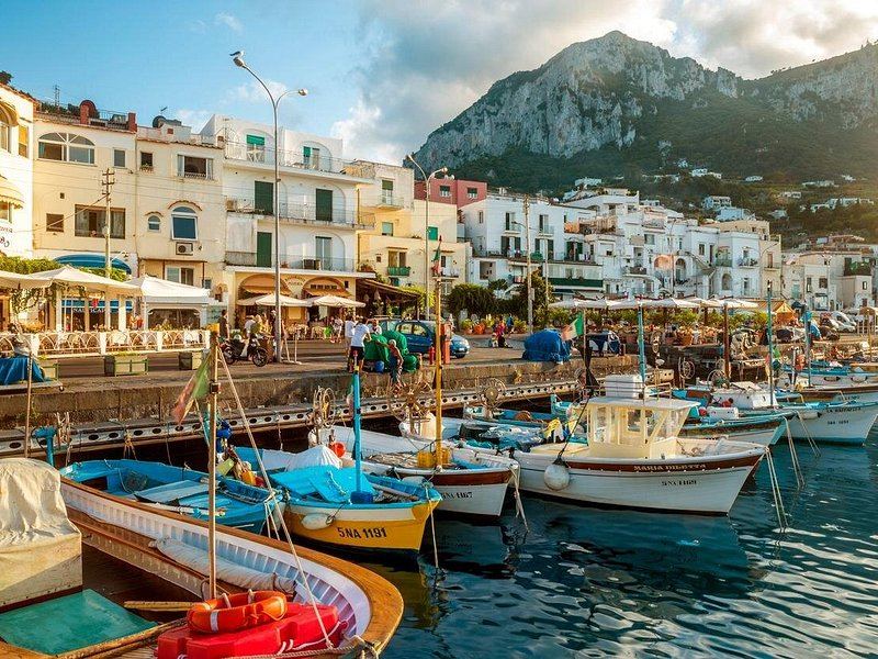 Painted wooden fishing boats drawn up on the quay at Marina Grande, Capri